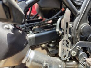 HIMALAYAN BS6 BREAK CYLINDER GUARD IN STAINLESS STEEL(BLACK POWDER COATED)